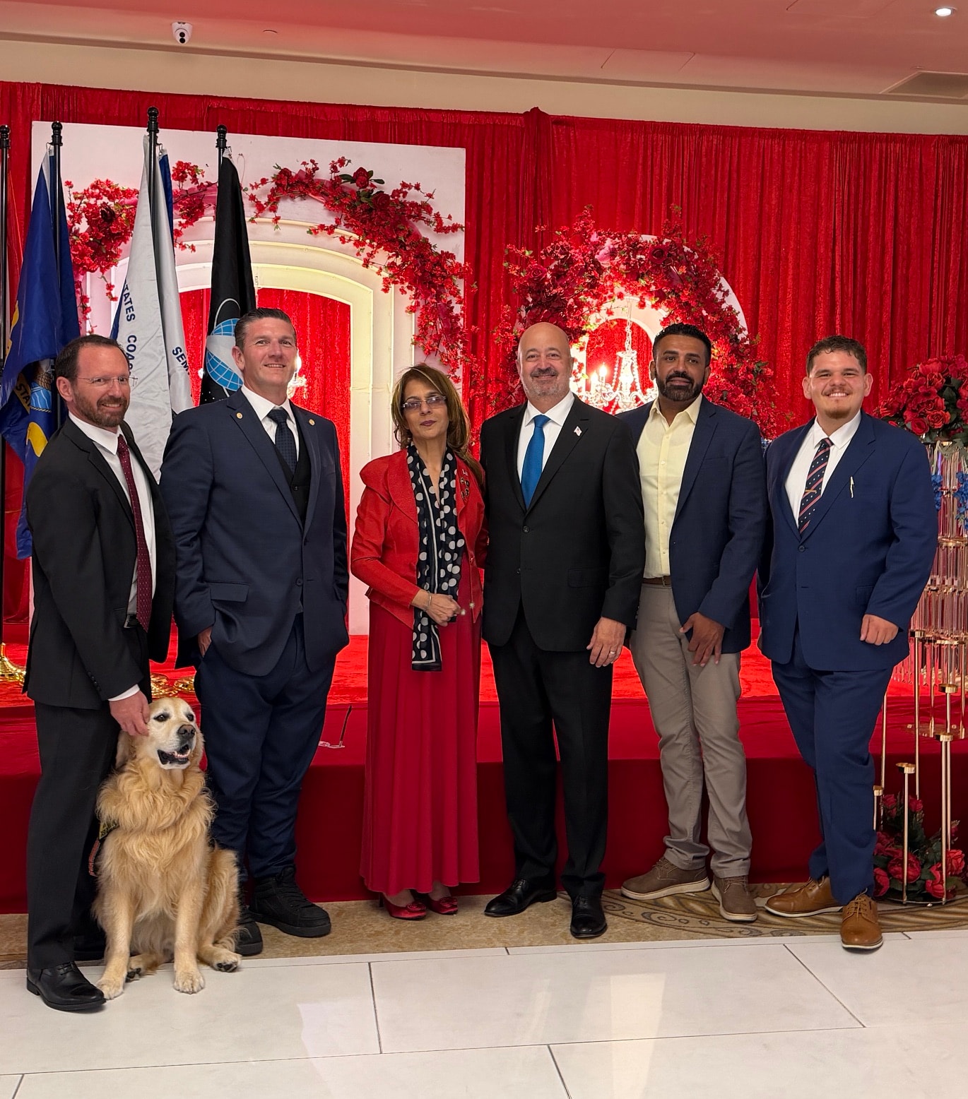 Dan Evans with community members at a formal gala event