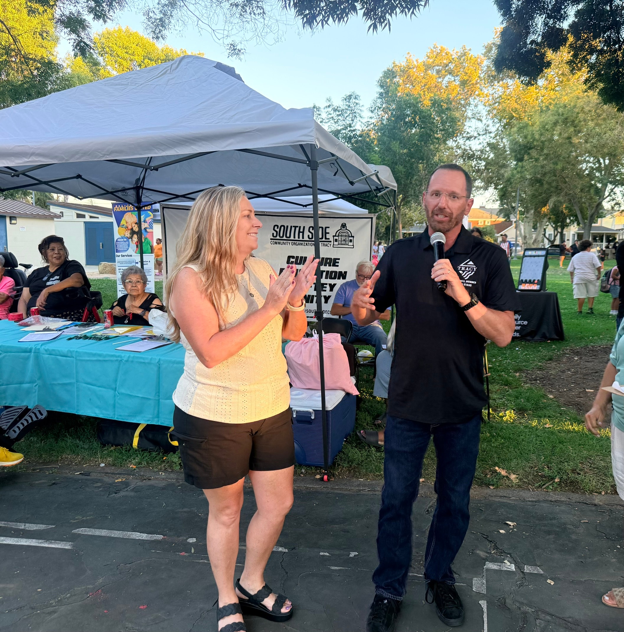Dan Evans speaking at a South Side community event